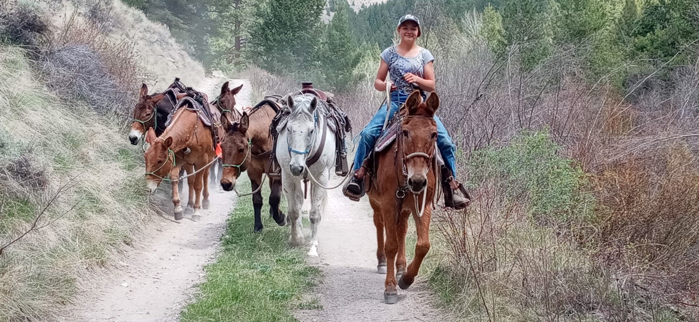 Tia and Foster leading a pack string
